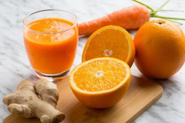 Bottle of Carrot, Orange & Ginger Glow juice – bright, refreshing, and energizing drink made with fresh carrot, citrus, and ginger.