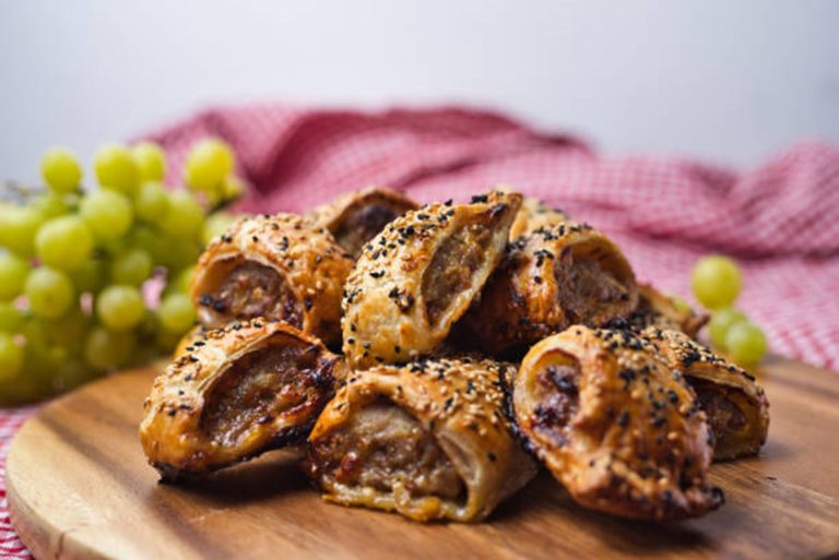 Golden-brown sausage roll swirls filled with hidden vegetables.